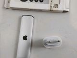 a white remote control and a white box on a table