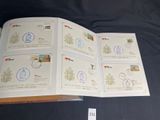 a lot of stamps on the pages of a book