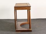 a small wooden table with a glass top on a carpeted floor