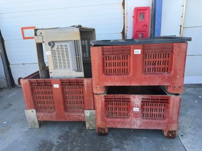 many crates stacked on top of each other in a garage