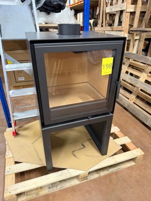 an image of a stove sitting on top of a pallet in a warehouse