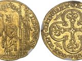 a gold coin with an image of a woman on it
