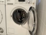 a washer and a dryer in a small room