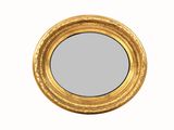 une image d'un miroir encadré d'or sur un mur blanc