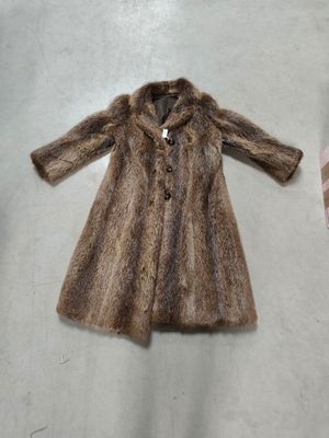 a picture of a brown fur coat on a table