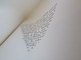 an open book with writing on it on a table