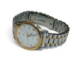 a silver and gold wrist watch on a white surface