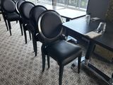 tables and chairs in a restaurant with a view of the outside