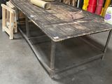 a table with a roll of paper on it in a garage