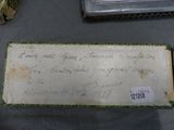 a piece of paper with writing on it sitting on a table
