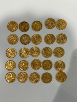 some of the gold coins have been placed on a white surface