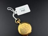 a close up of a gold locke with a tag on it