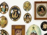 many different pictures on the wall of this room