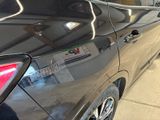 a close up of a car parked in a parking lot