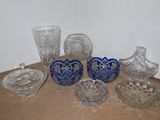 a lot of glass items sitting on a table