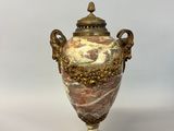 an image of a vase with a lid sitting on top of a marble base