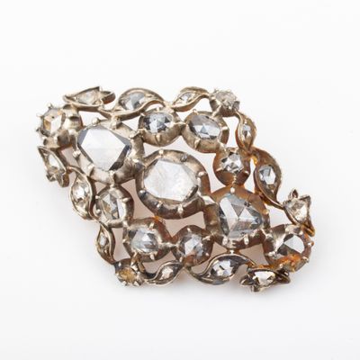 an image of a close up of a broochle on a white surface