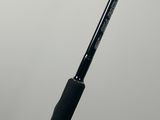 a close up of a fishing rod on a white surface
