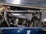 a close up view of a car engine with its hood open