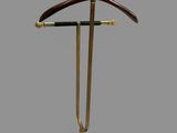 a suit hanger on a stand with a ring on it