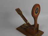 a wooden spoon and a wooden spoon rest on a white surface