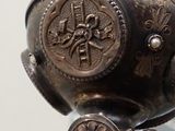 a close up of a metal object with a bird on it