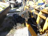 a bulldozer that is sitting on the side of the road