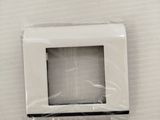 a white microwave sitting in the middle of a white wall
