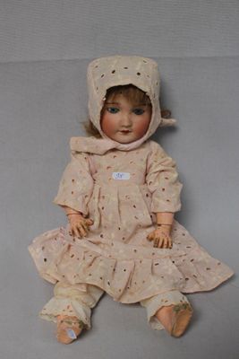 a small doll that is sitting on the floor