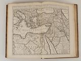 an old book with a map of the world on it