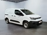 the white van is parked in a large room