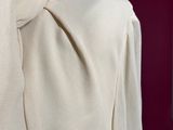 a white shirt with a tie on a mannequin dummy