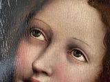 an oil painting of a woman looking out of a window with a bird in her hand