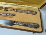 a silverware set in a box on a table