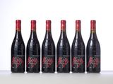 six bottles of red wine lined up in a row