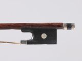 a close up of a violin bow on a white background