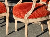 two chairs sitting next to each other on the street