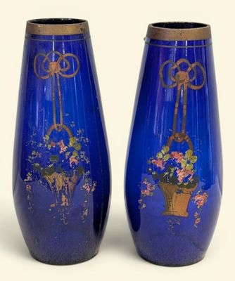 two vases that have been painted with flowers on them