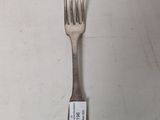 a fork with a tag on it sitting on a table
