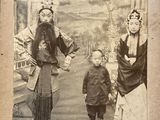 an old photo of a man and a woman with a child