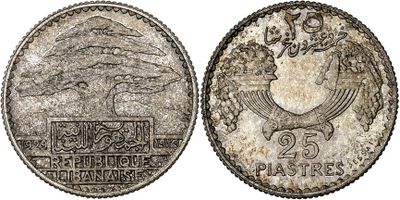 a silver coin with a picture of a tree on it