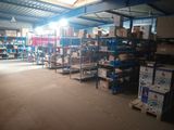 a large warehouse filled with lots of boxes and shelves