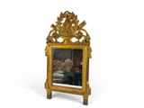 an image of a mirror with a picture of a man in a boat on it