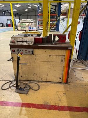 a machine that is sitting in the middle of a warehouse