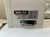 a close up of a baby lock on a white box