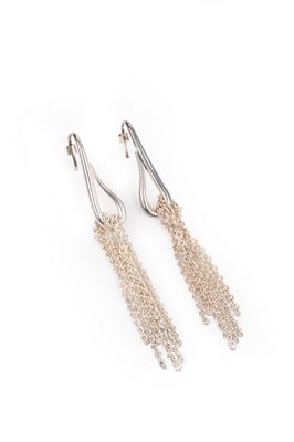 a pair of silver earrings on a white background