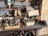 many tools on a workbench in a garage