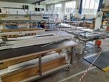 a large room with many tables and benches in it