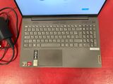 a laptop that is sitting on a table with a charger