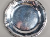 a silver plate that is on a table